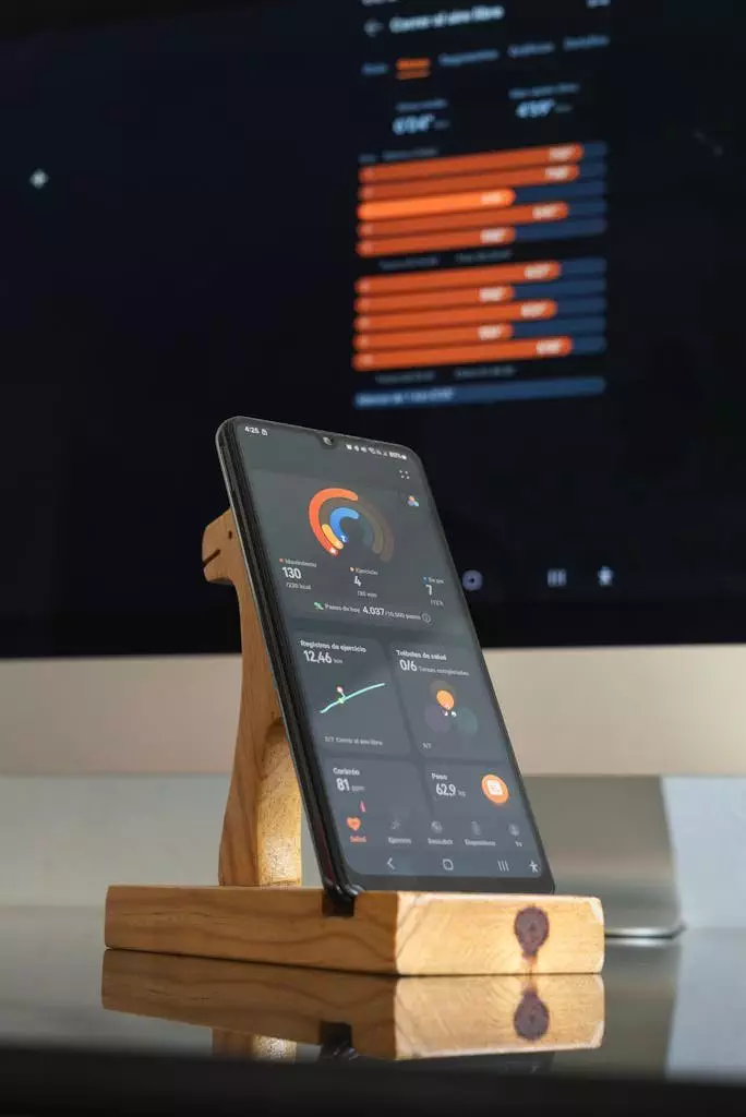 A wooden phone stand with a smartphone on it
